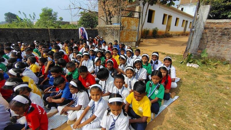 Outdoor session beside the school building